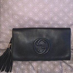 Black leather Gucci clutch